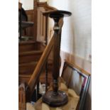 An early 20th Century oak torchere