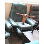A green leather Stressless style reclining armchair with matching foot stool