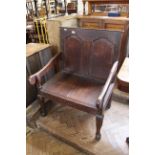 A late 18th Century oak two seater chair,