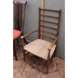 An oak ladderback armchair in William Morris style,