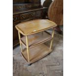 A mid Century Ercol blonde teak hostess trolley