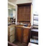 A late 19th Century satinwood cupboard bookcase