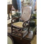 A late 19th Century mahogany child's rocking chair with painted decoration