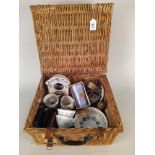 A wicker picnic basket and contents including an Eric Ravilious for Wedgwood alphabet dish (as