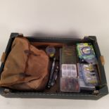 A box containing a quantity of salmon and trout flies, spools of line, small lures,