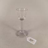 An English wine glass c1750 with ovoid shaped bowl (chip to rim) above plain stem,