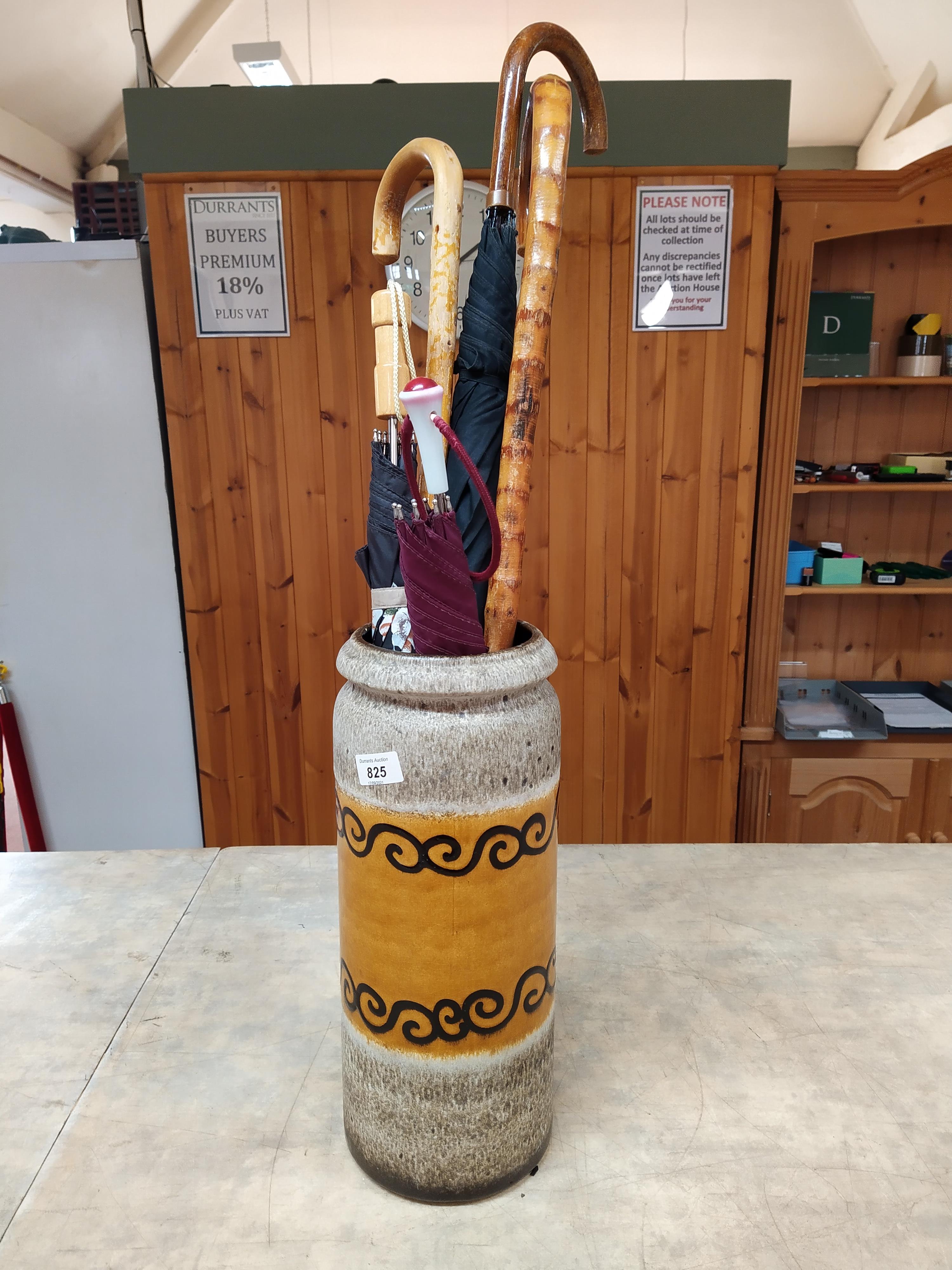 A large West German vase plus a selection of umbrellas and walking sticks