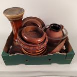 A box of mainly turned wood bowls and plates plus a stoneware jug and jardinière base