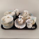 A Limoges R Delinieres France part tea set, eight cups and saucers, milk, sugar and side plate,