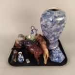 A large blue and white lidded jar, a Beswick lion and buffalo (as found horn),