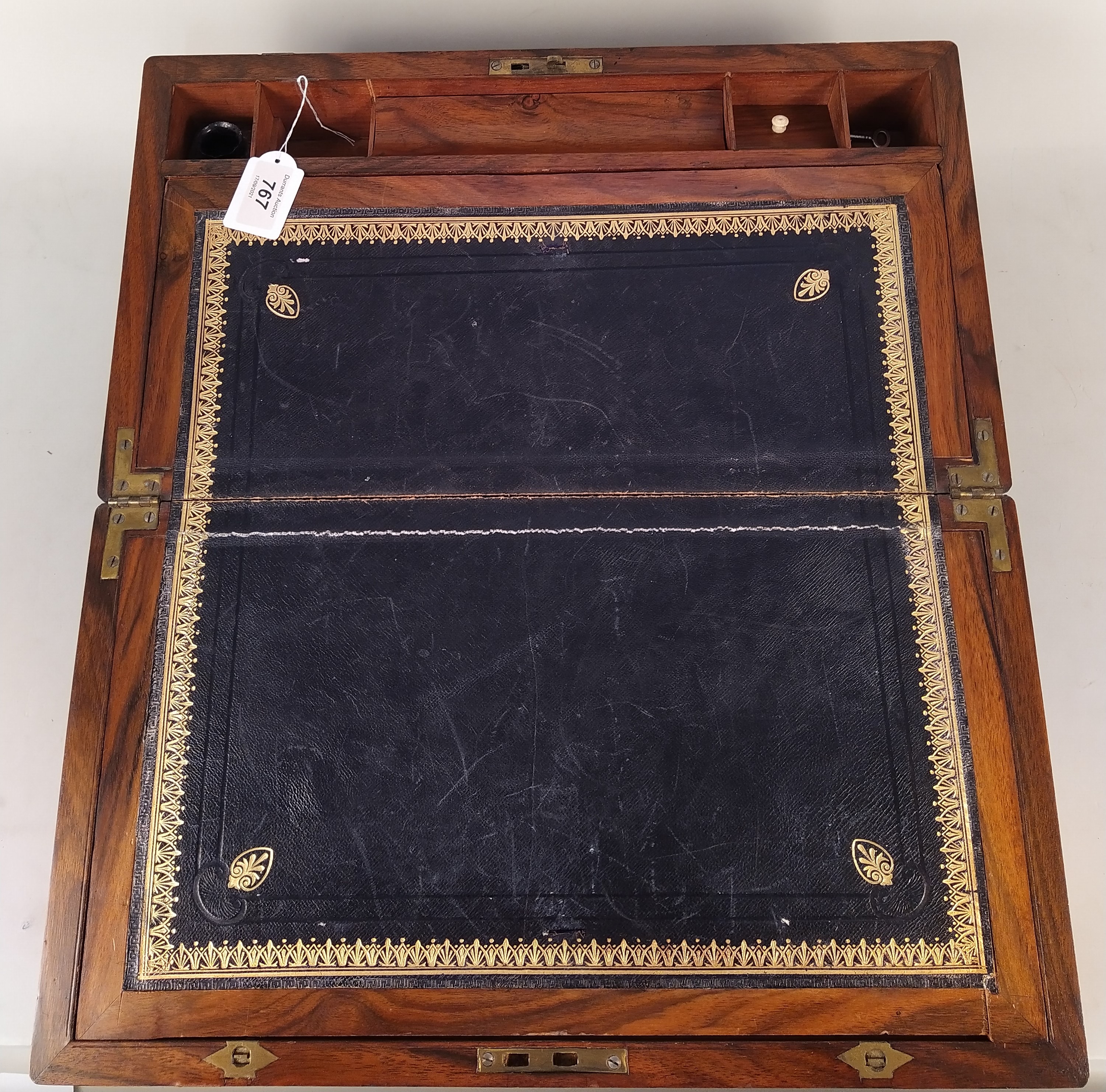 A fine 19th Century wood and brass bound travelling writing slope with leather interior and secret