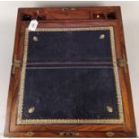 A fine 19th Century wood and brass bound travelling writing slope with leather interior and secret