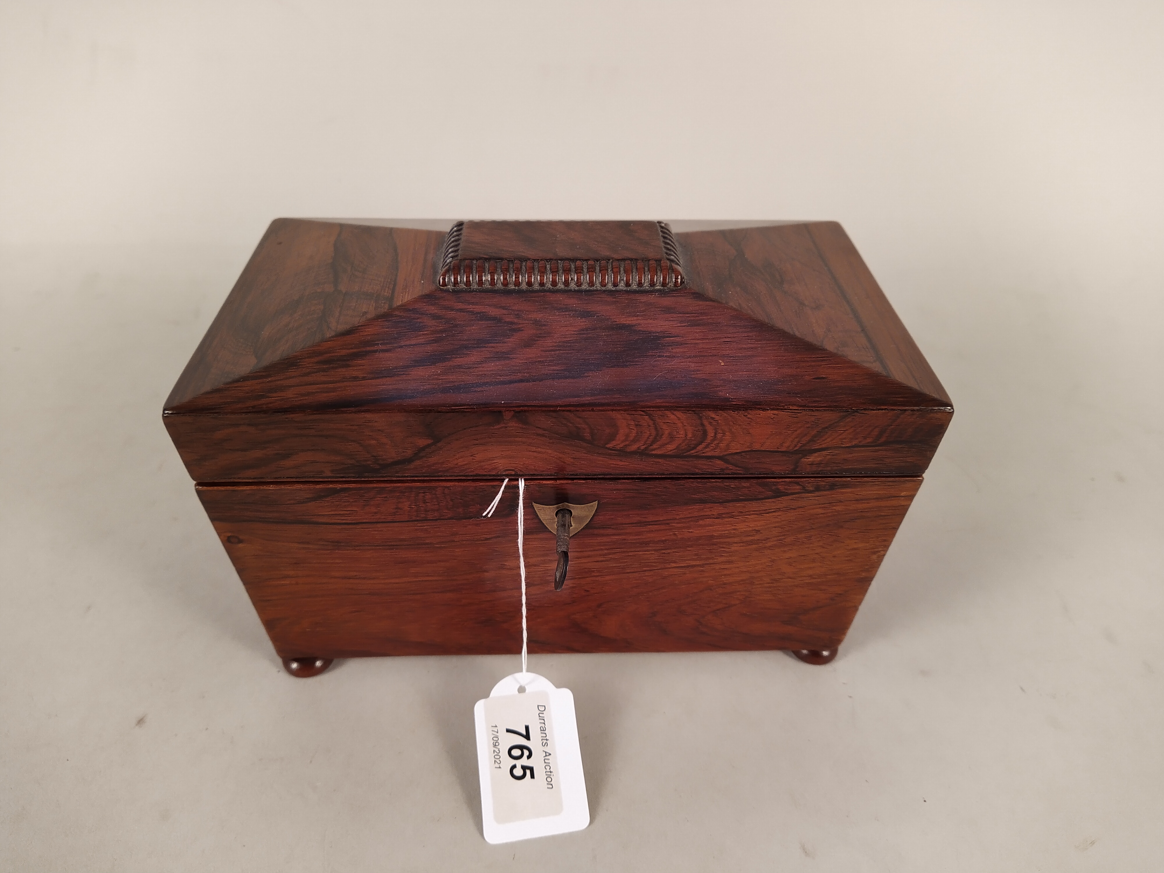 A Victorian rosewood veneered double section tea caddy with void interior and four bun feet, - Image 2 of 3