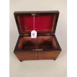 A Victorian rosewood veneered double section tea caddy with void interior and four bun feet,