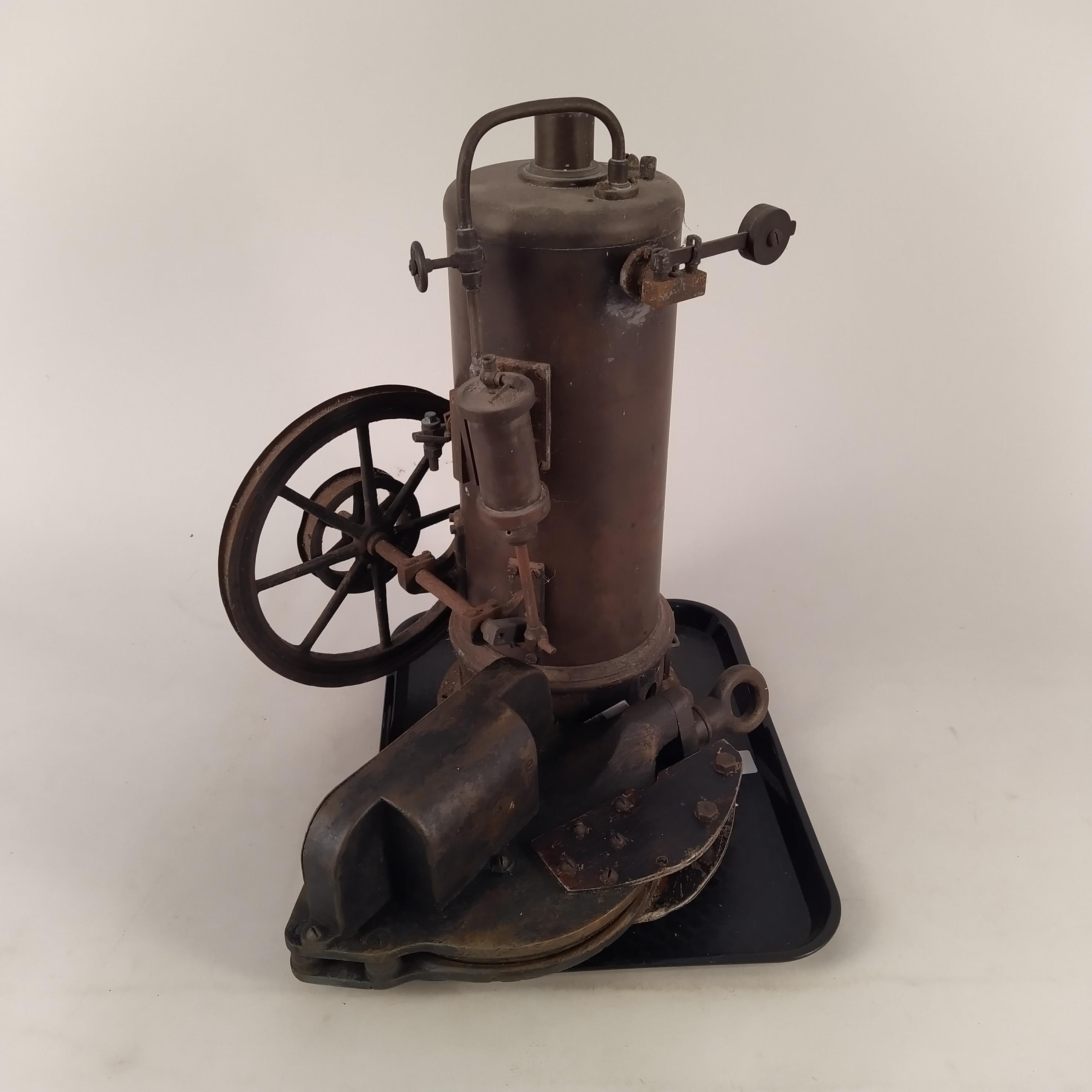 An early 20th Century copper steam boiler with pulley wheel,