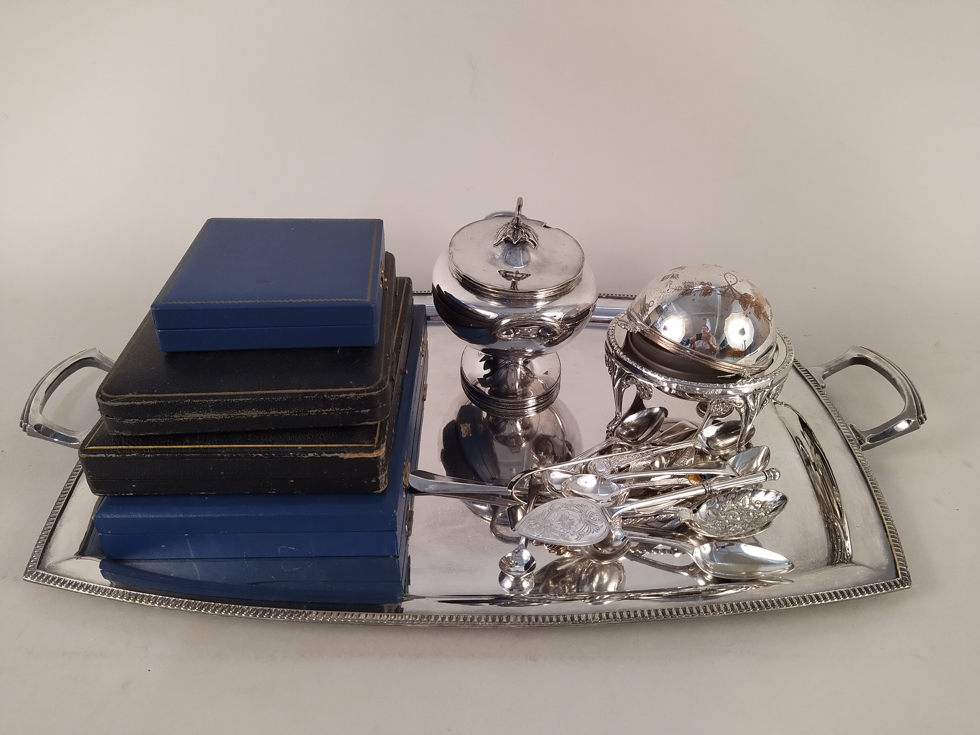 A large silver plated serving tray plus various plated flatware,