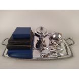 A large silver plated serving tray plus various plated flatware,
