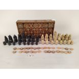 An inlaid decorative games box plus a Medieval style resin chess set