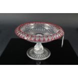 An early 20th Century clear glass with cranberry overlay on rim stemmed dish,