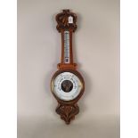 An oak banjo barometer with Art Nouveau influence,