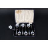 A cased set of six silver soup spoons, hallmarked Sheffield 1936,