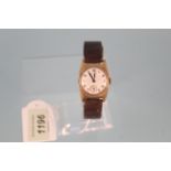 A c1940's gent's 9ct gold mid size wristwatch