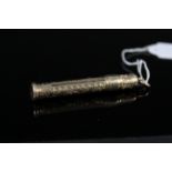 A 9ct gold pencil holder with engraved decoration