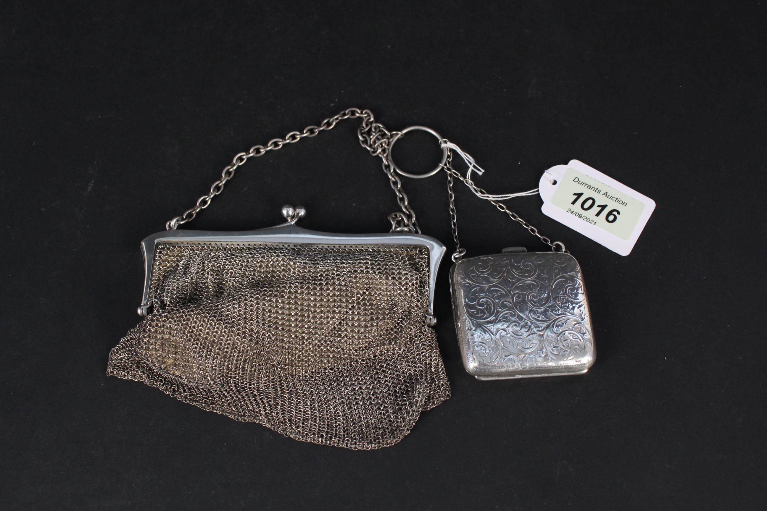 A silver chain mail purse, hallmarked London 1913 plus a small silver silk lined purse (as found),