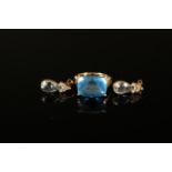 A 9ct gold multi faceted blue topaz set ring with white gold decoration to setting plus a pair of