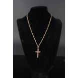 A 9ct gold cross on 9ct gold chain, weight approx 7.