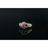 An antique 9ct gold amethyst and pearl set ring (evidence of repair to shank), size O 1/2,