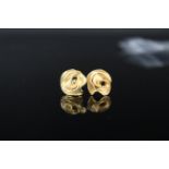 A pair of 9ct gold abstract flower form earrings,