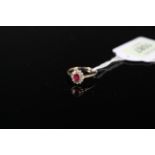 A 9ct gold ruby and diamond set ring, size N 1/2,