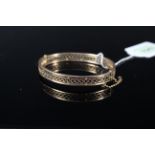 A 9ct gold pierced design bangle (small split noted),