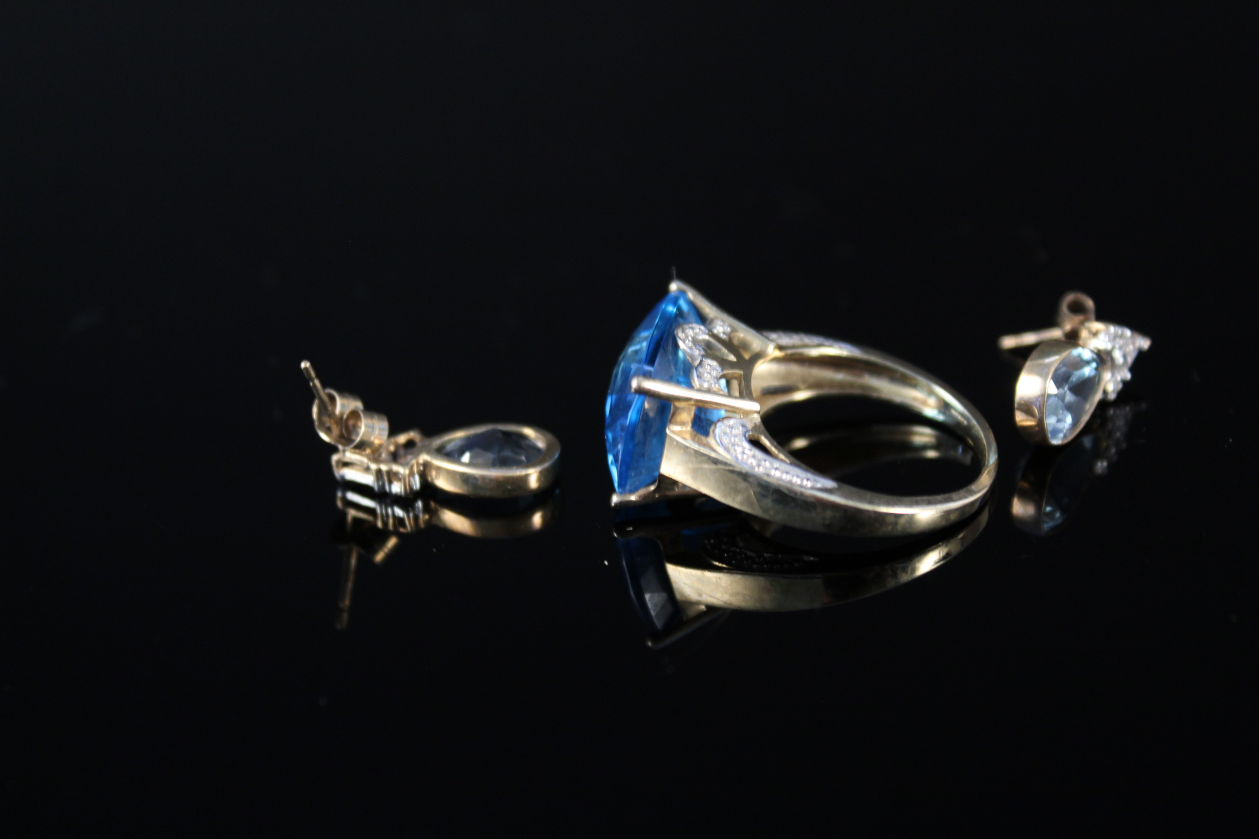 A 9ct gold multi faceted blue topaz set ring with white gold decoration to setting plus a pair of - Image 3 of 3