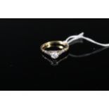 An 18ct gold solitaire diamond ring in raised claw setting, size M, weight approx 2.
