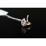 A 9ct gold tanzanite and diamond set ring, size M 1/2,