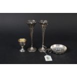 A silver egg cup with presentation inscription,