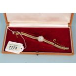 A ladies Longines 9ct gold wristwatch on 9ct gold bracelet