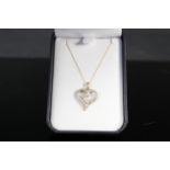 A 9ct gold diamond set heart pendant on 9ct gold chain, weight approx 2.