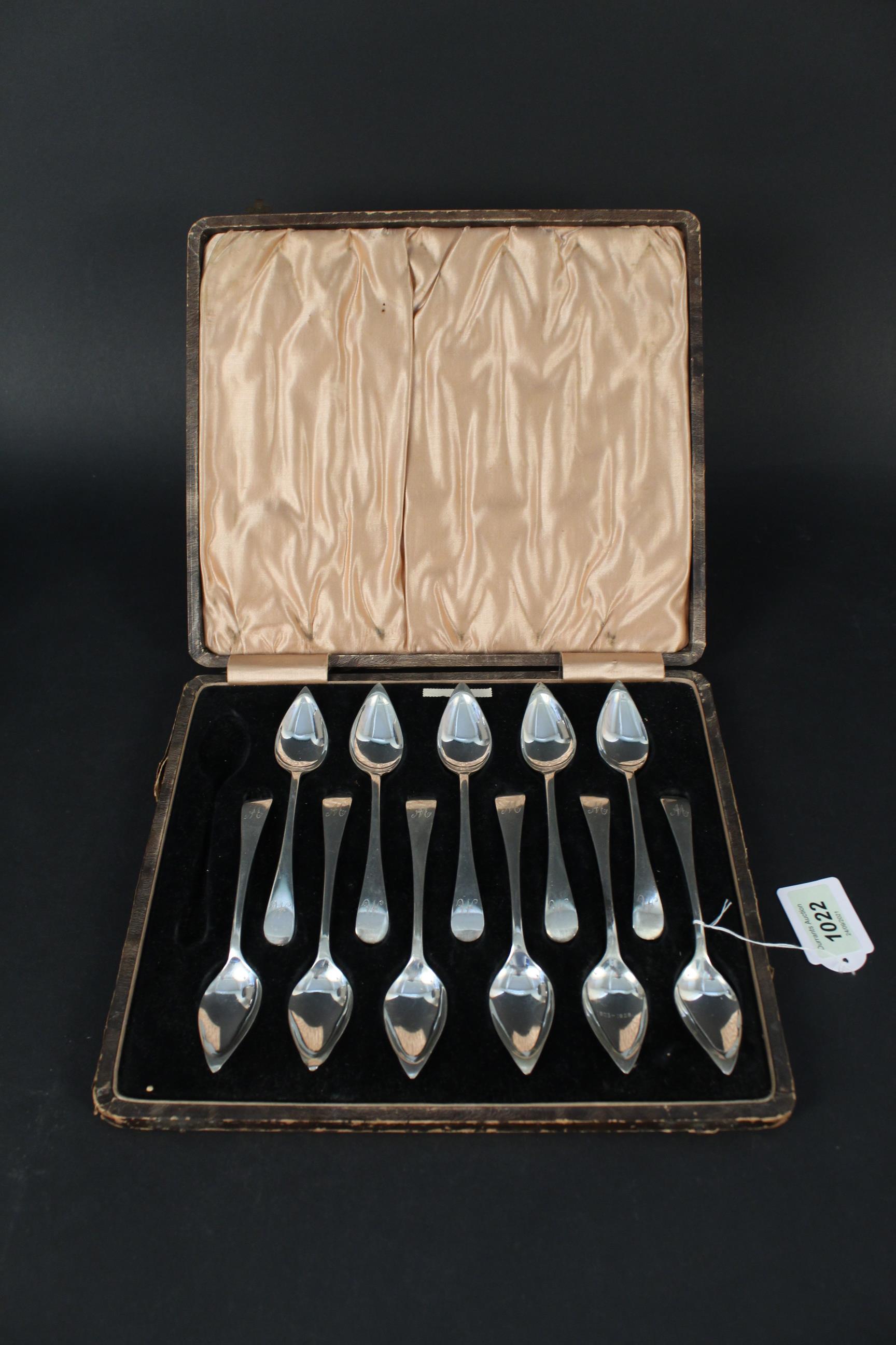 Eleven (of twelve) silver grapefruit spoons in original case, each spoon engraved with initial,