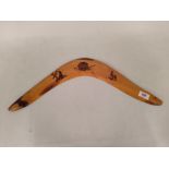 An aboriginal boomerang with pokerwork decoration,