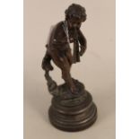 A vintage bronze figurine of Pan playing flute, marked France to base, mounted on a spelter base,