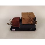 A vintage Brownie model E box camera in case and a vintage box camera by Houghton Butcher,