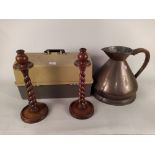 A pair of 1920's oak barley twist candlesticks, a copper jug stamped "2 gallons V.R.