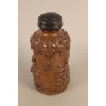 An early 19th Century treacle glaze stoneware bottle with pewter lid and internal cap 7 3/4" high