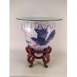 A Chinese porcelain fish bowl on stand,