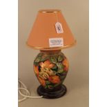 A Moorcroft Flame of the Forest pattern table lamp with shade,