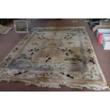 A large cream Chinese wool carpet,