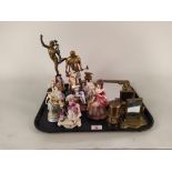 A selection of nine German porcelain figures, three brass mirrors, a brass model blacksmith,
